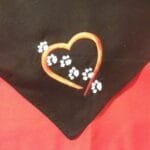 black bandana embroidered with red heart and white paw prints