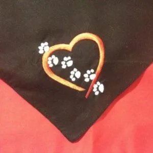 black bandana embroidered with red heart and white paw prints