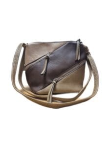 Stylish two-tone handbag with contrasting panels and top handles