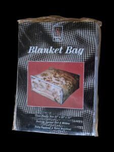 Large clear plastic blanket bag by Signature Series with white trim and zipper closure