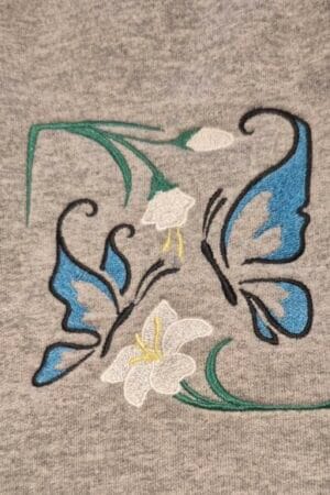 Open weave Embroidered butterflies and flowers on sweatshirt
