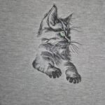 black cat with green eyes embroidered on a Fruit of the Loom sweatshirt