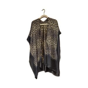 Silky leopard print kimono hanging on a hanger with a flowing open‑front design.