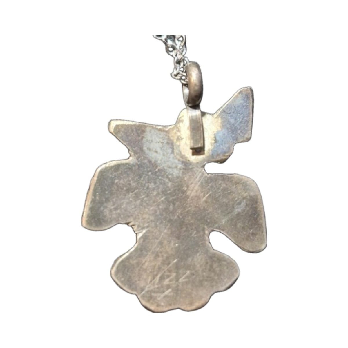 Vintage Southwestern Style Thunderbird Pendant Necklace 4 Back of vintage thunderbird pendant showing stamped design markings